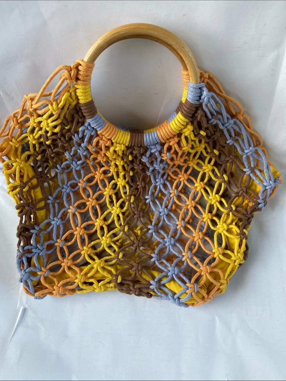 Knitted handbag measures 10x14”, wooden handle